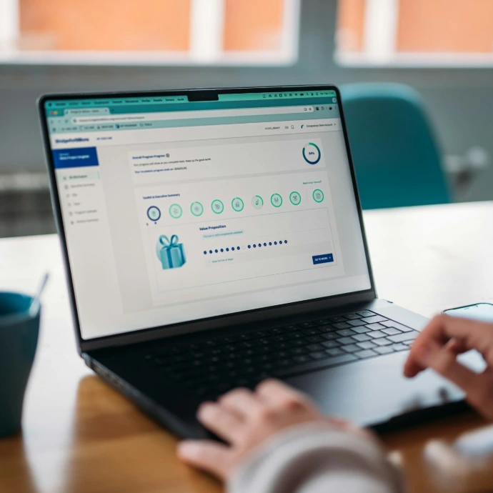 Person using a laptop to review a rewards program.
